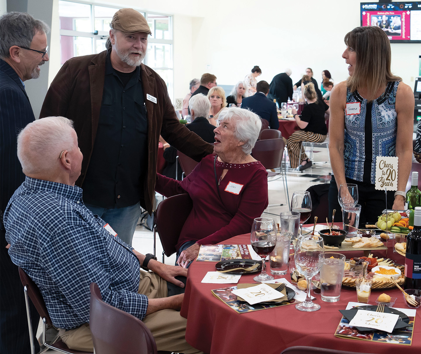 Klamath Community College President Dr. Roberto Gutierrez, at left, greets donors and volunteers at the KCC State of the Foundation gathering Sept. 26. (Caleb Herrera/KCC photo)